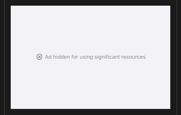 A cropped screenshot of Safari on iOS 26 showing an advertising frame that is white with grey text that reads: Ad hidden for using significant resources