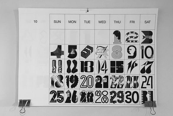 October page on Tezzo Suzuki calendar 2026, showcasing a set of rather dark illustrated numbers.
