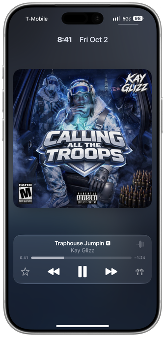 A framed screenshot of the iOS 27 lock screen showing the enlarged album artwork view with the player at the bottom, and a thin bar above the artwork for the time and date.